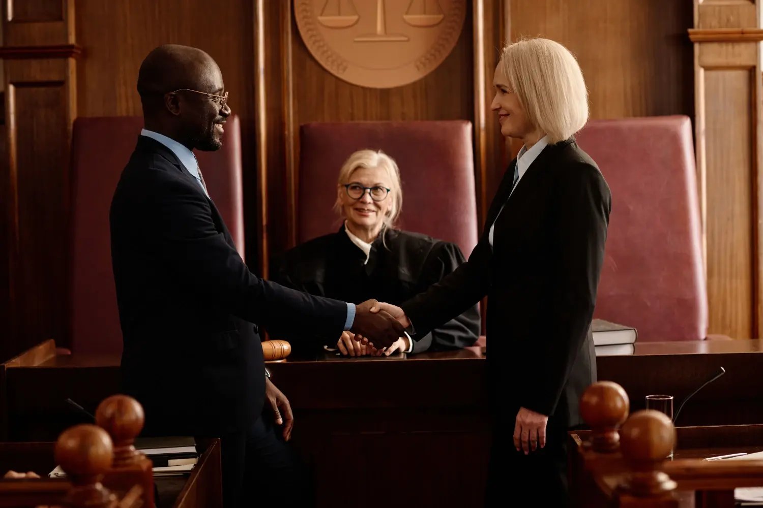 Side view of happy prosecutor and attorney