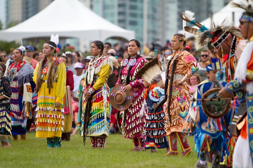 Nations dancers watch the Canada Day celebrations in Calgary