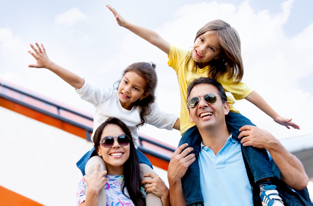 Happy family wth two kids traveling by airplane