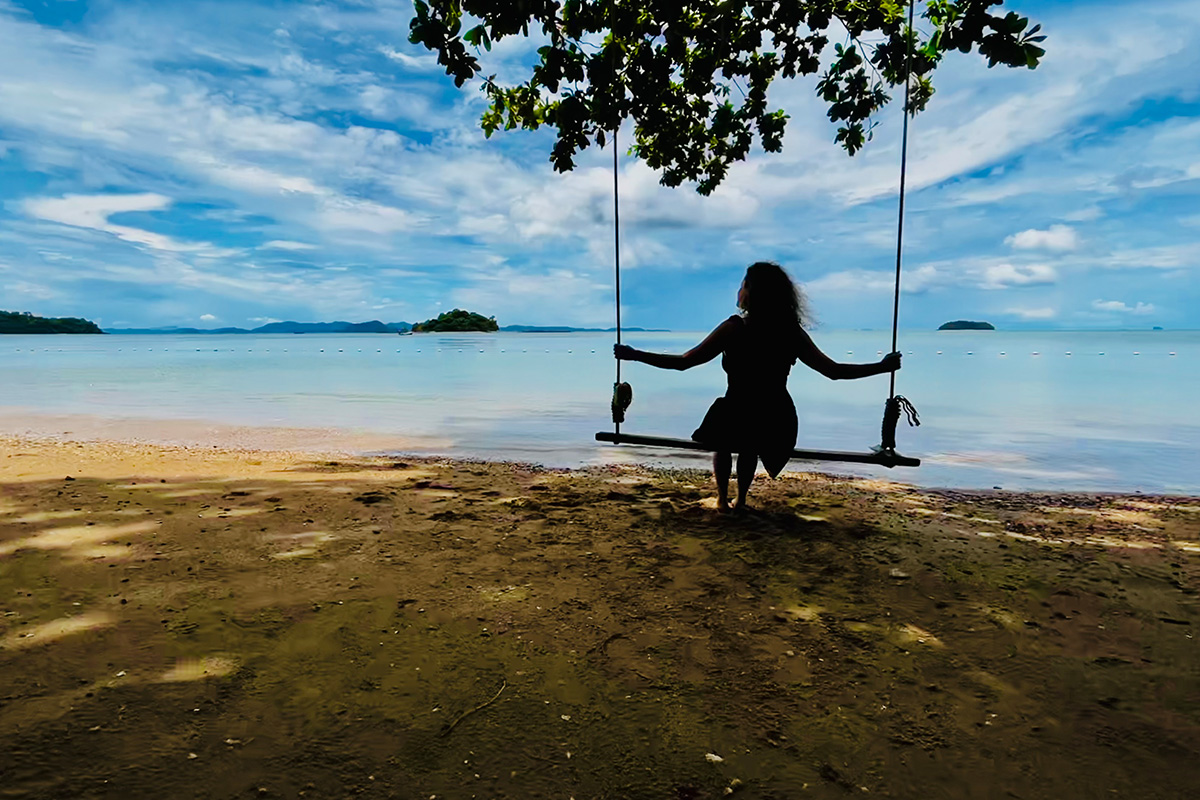 Ad Astra Community engagement rep Karen smilles in a hammock in Phi Phi Island