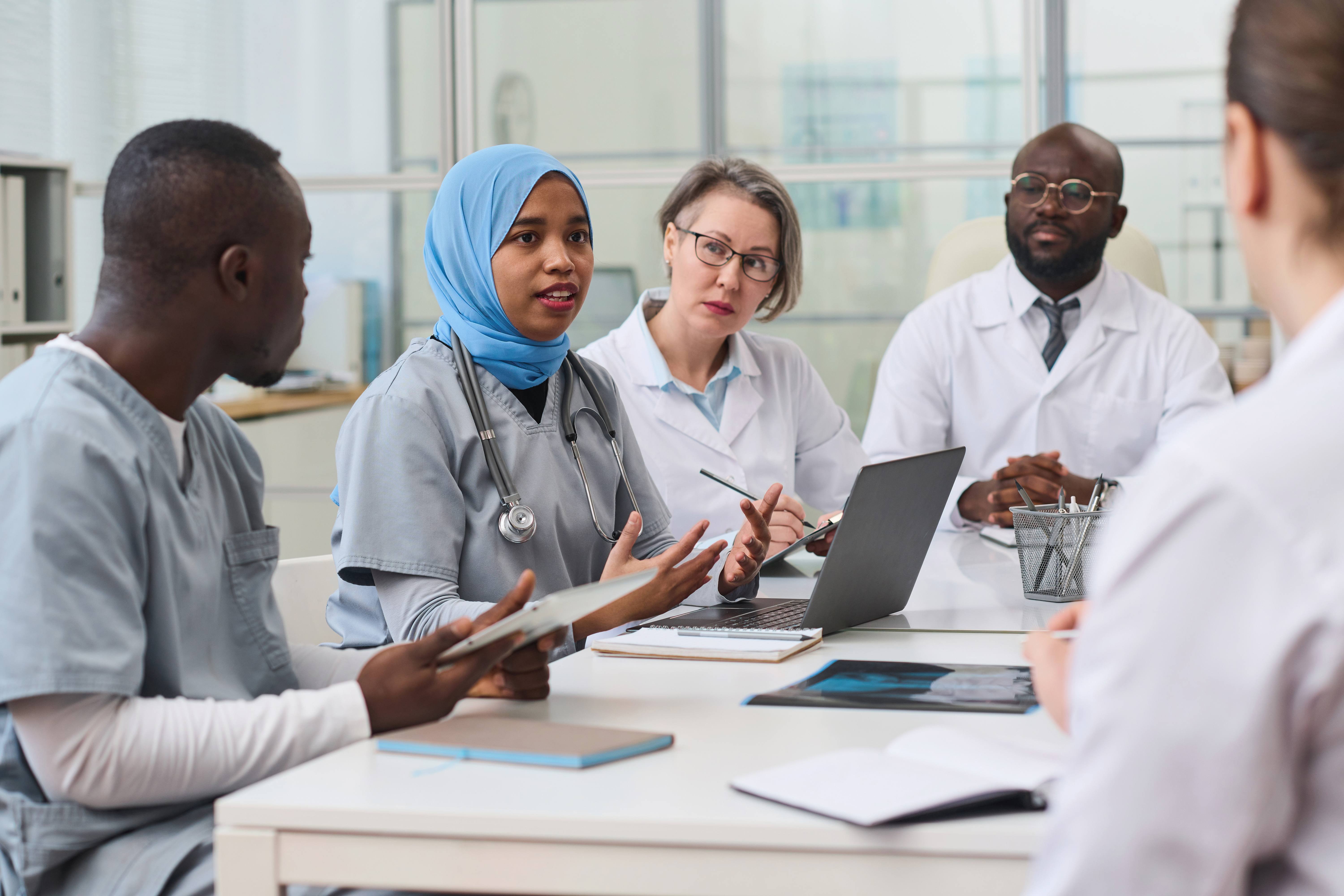 colleagues-discussing-difficult-operation-at-meeti-2025-02-12-01-59-52-utc