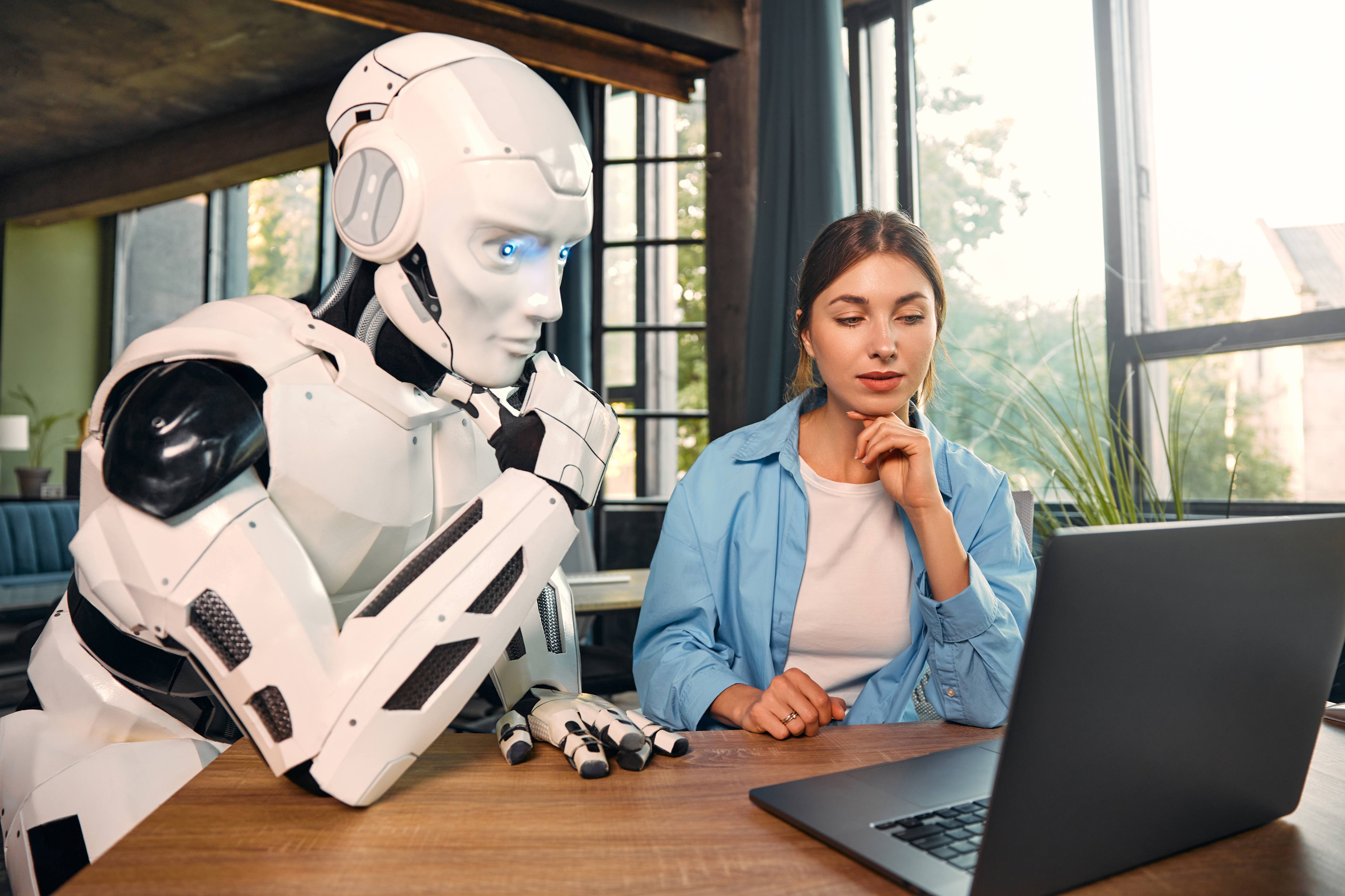 robot-and-woman-working-on-laptop-in-office-2025-03-25-02-56-47-utc (1)