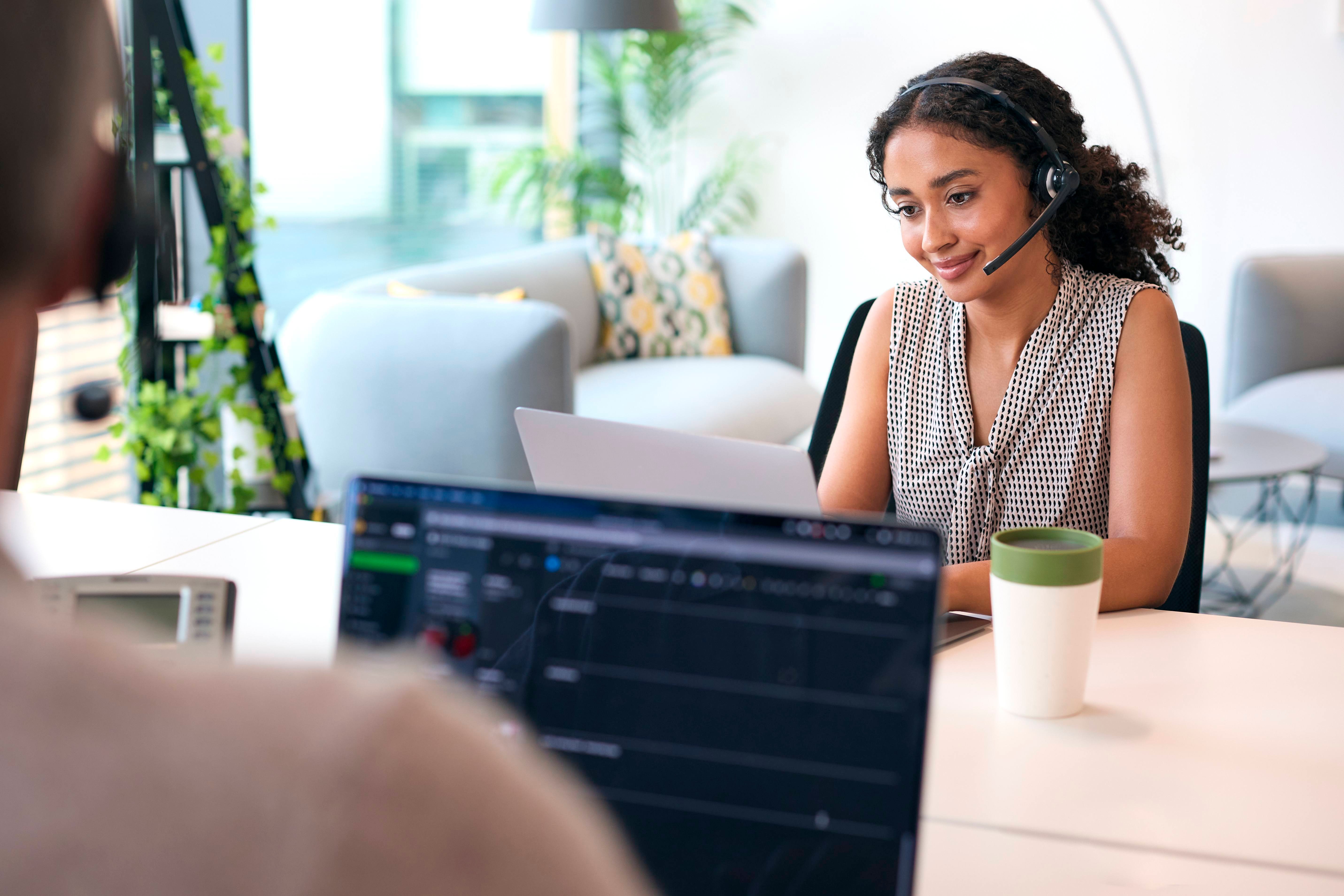 remote interpreting working on her laptop